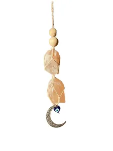 Bohemian wall decor with raw Himalayan salt stones, wood beads and blue evil eye charm