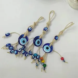 Handmade Turkish Nazar Evil Eye ornaments with blue glass beads and woven hemp rope cord