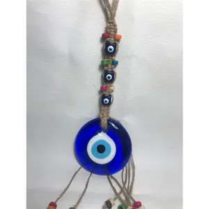 Decorazione da parete malocchio turco con perla nazar blu e perle di legno colorate su iuta