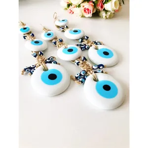 Three-piece Turkish Evil Eye wall hangings with blue beads and natural woven hemp rope