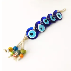 Decorazione da parete con Occhio di Allah in vetro blu e corda di canapa intrecciata