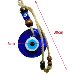 Detail of 30cm Evil Eye wall hanging with wood beads and 6cm blue glass talisman