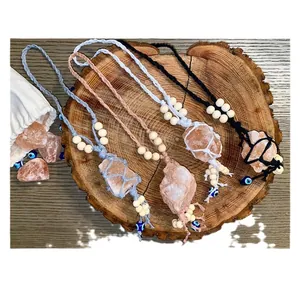 Handwoven Himalaya salt crystal wall hanging set with evil eye charms on wood