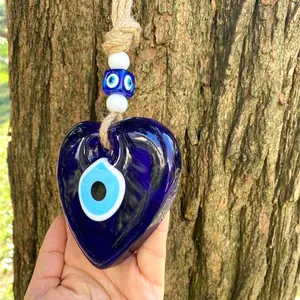 Blue glass heart-shaped Turkish Evil Eye wall hanging with natural jute rope and beads