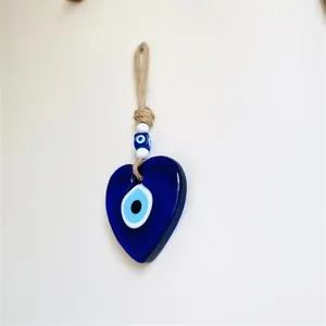 Blue glass heart-shaped Evil Eye wall hanging ornament with rustic jute rope
