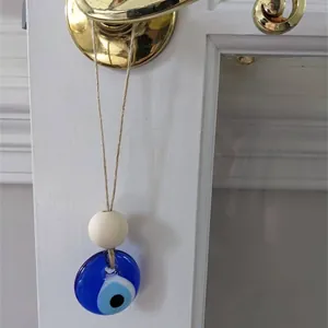 Blue glass evil eye wall hanging charm with wooden bead and natural jute rope decor