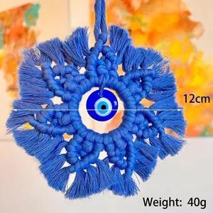 Handmade bohemian macrame evil eye wall hanging with blue cotton tassels 12cm