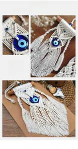 Detailed macro view of handmade boho evil eye wall hanging with white cotton rope fringe
