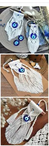 Detail of handmade macrame wall hanging featuring blue glass evil eye and cotton fringe