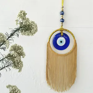 Décoration murale Evil Eye faite main avec glands dorés et perles en verre nazar