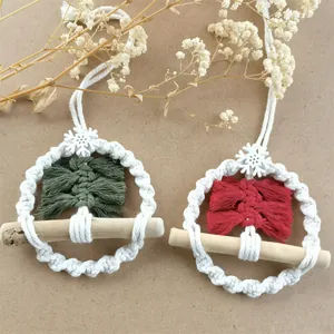 Detailed macro view of handmade macrame Christmas tree ornaments with wooden rings