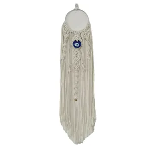 Handmade bohemian white cotton rope macrame wall hanging with blue evil eye amulet