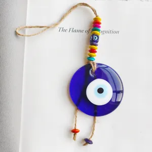 Macro detail of handmade Nazar evil eye glass hanging ornament with colorful beads