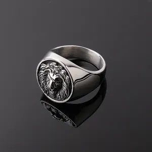 Macro shot of retro lion head relief on stainless steel ring with vintage finish