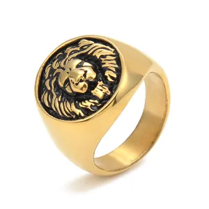 Macro detail of the majestic gold lion head relief on a vintage stainless steel ring