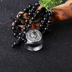 Vintage stainless steel lion head ring for men with detailed lion king relief on dark base