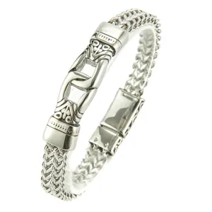 Bracciale da uomo a doppia catena intrecciata in acciaio lucido con motivi a rilievo
