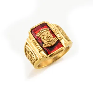 Detail of gold stainless steel Walton Tigers ring with a red stone and tiger head emblem