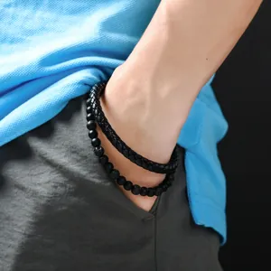 Set bracciale da uomo in pelle nera intrecciata e perline di pietra lavica naturale