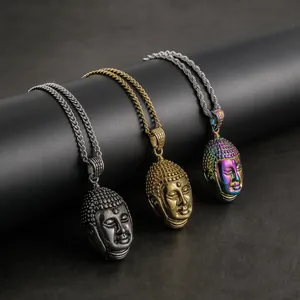 Three Buddha head pendant necklaces in silver, gold and rainbow colors on black stand