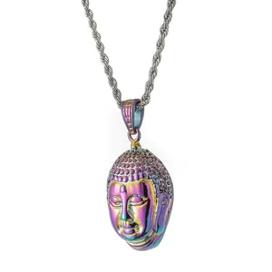 Macro shot of colorful iridescent Buddha head pendant on silver twisted rope chain