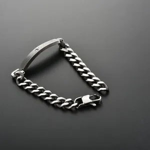 Vintage stainless steel Cuban link bracelet with cross engraved curved metal plate