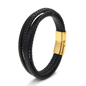 Detail of multi-layer black woven leather bracelet with a polished gold magnetic clasp