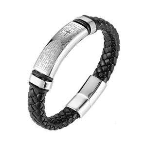 Detail of braided leather bracelet with engraved stainless steel cross and Lord's Prayer