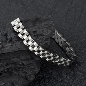 Macro shot of silver polished stainless steel watch band bracelet on dark textured background