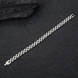 Detail of stainless steel watch band bracelet with brushed finish and folding clasp