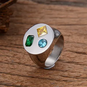 Anillo de sello de acero cepillado con circonitas geométricas amarillas, verdes y azules