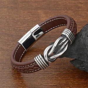 Detailed view of brown braided leather bracelet with silver stainless steel magnetic clasp