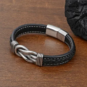 Close-up of men's leather bracelet with silver twist metal and magnetic buckle