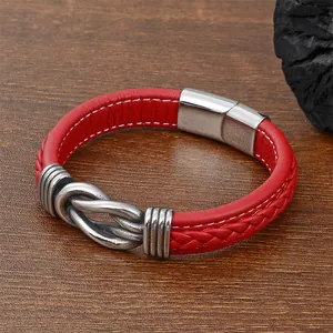Detail of red braided leather bracelet with stainless steel twist metal buckle design