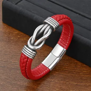 Close-up of red braided leather bracelet with vintage silver knot and magnetic buckle