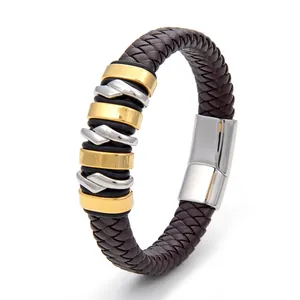 Detail of dark brown braided leather bracelet with gold and silver metal accents