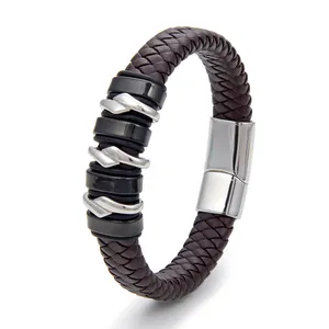 Detailed view of dark brown braided leather bracelet with silver and black metal charms