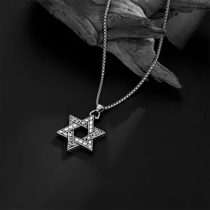 Detail of solid hexagram pendant with intricate carvings on square bead chain