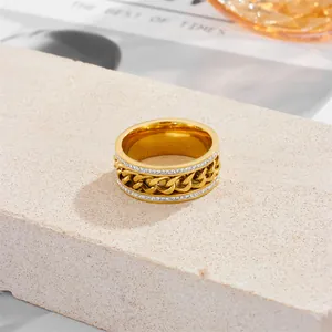 Bague en acier inoxydable doré avec chaîne rotative et double rangée de zircons brillants