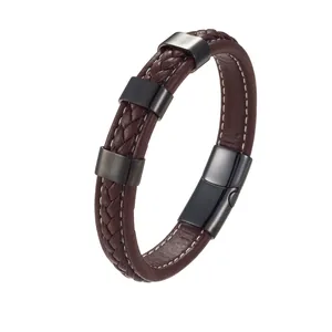 Detail of brown braided leather bracelet with white stitching and gunmetal magnetic clasp