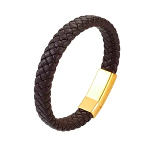 Detail of dark brown braided leather bracelet with polished gold magnetic clasp