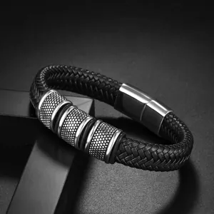 Men's black woven leather bracelet with silver textured rings and magnetic clasp