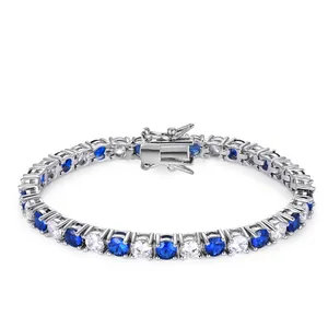 Detail of silver tennis bracelet featuring alternating blue and white cubic zirconia stones