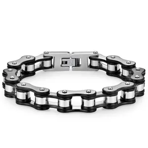 Detail of two-tone stainless steel bike chain bracelet with polished link texture