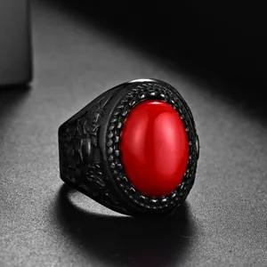 Gothic punk men's ring with red oval stone and skull rose carvings on black metal