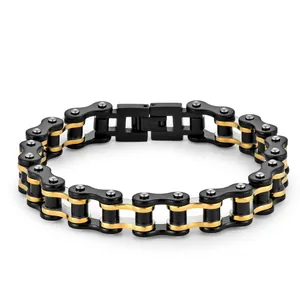 Detail of bicycle chain bracelet with black and gold stainless steel links and fold-over clasp