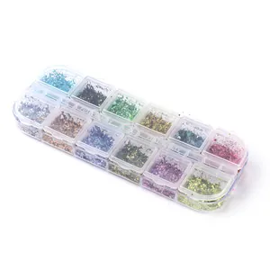 Macro shot of 12-color iridescent nail glitter flakes in a transparent organizer box