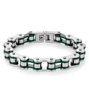 Detailed macro of stainless steel bicycle link bracelet with green accents and engraved clasp