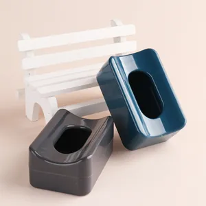 Detail view of glossy plastic nail powder collection boxes in blue and grey colors