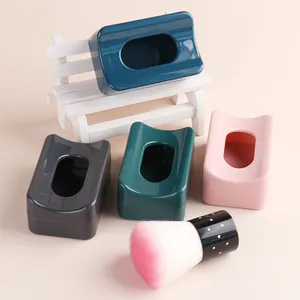 Close-up of portable nail dipping powder recycling storage boxes with gradient brush